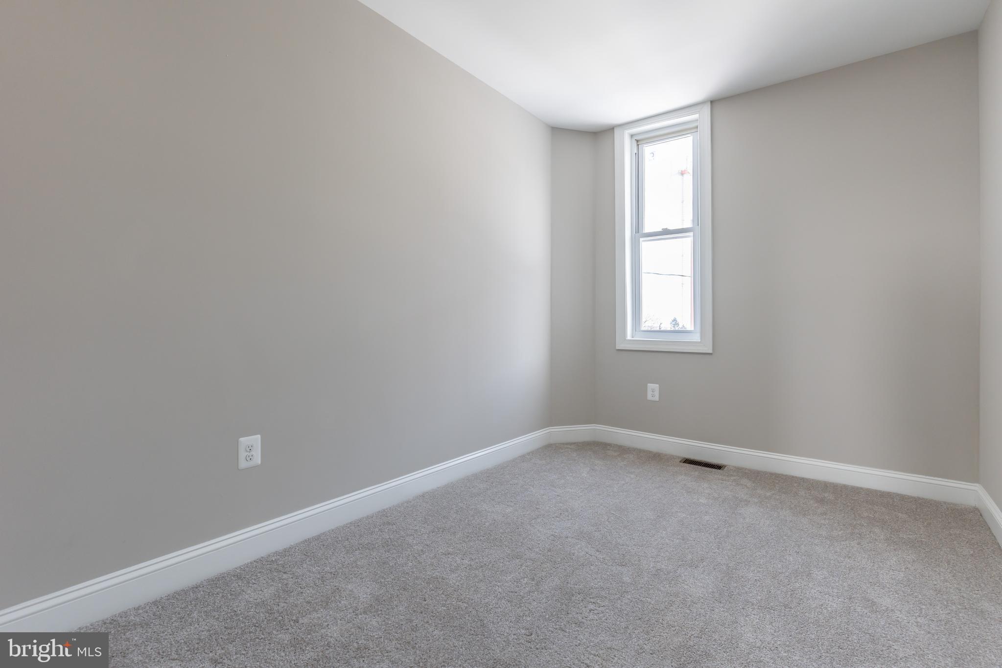 3651 Cottage Avenue Baltimore, MD 21215 - Photo 26 of 38 an empty room with a window