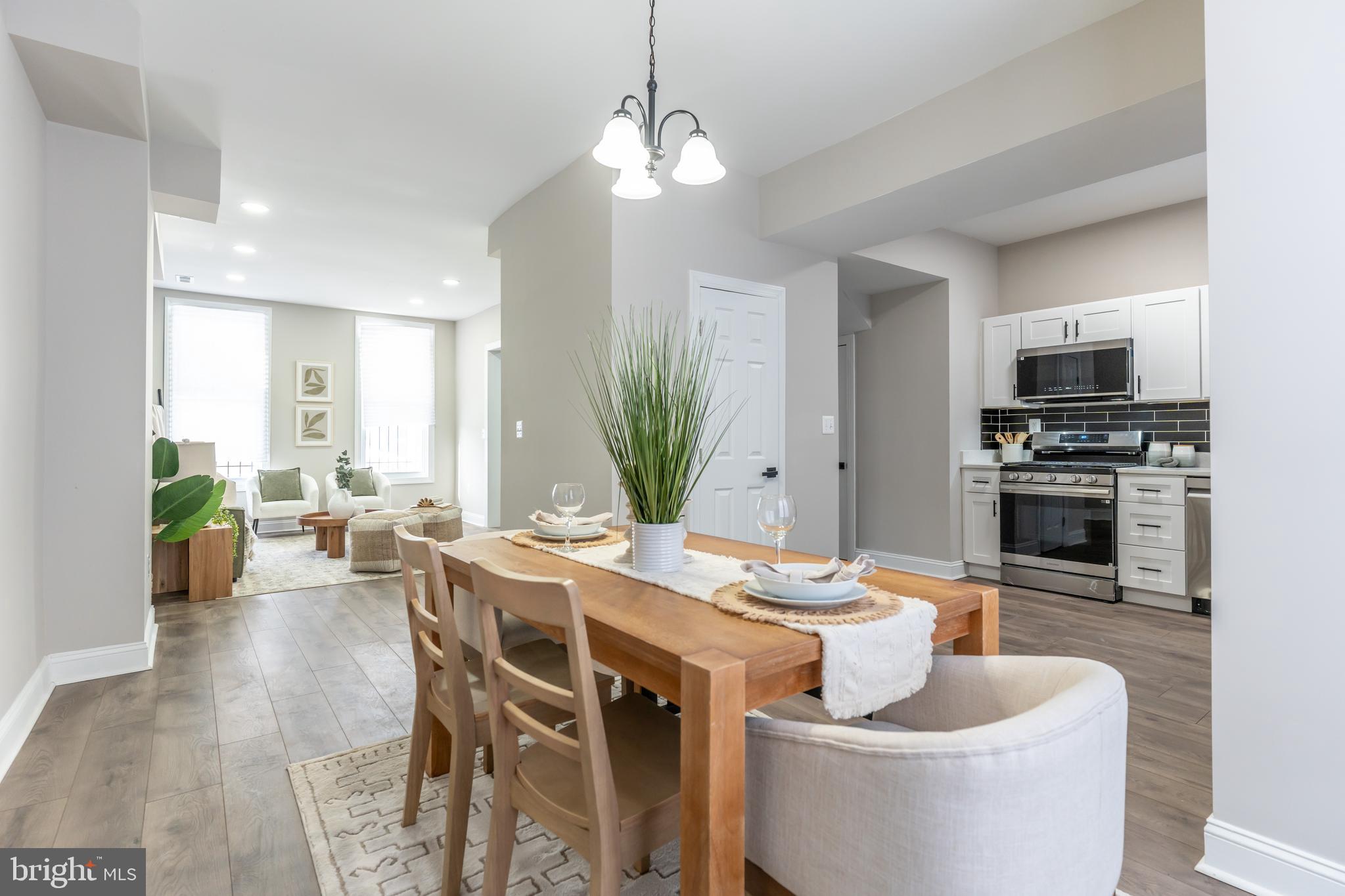 3651 Cottage Avenue Baltimore, MD 21215 - Photo 3 of 38 a living room with furniture a fireplace and a flat screen tv
