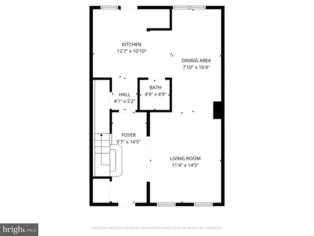 a picture of a bench in front of a wall