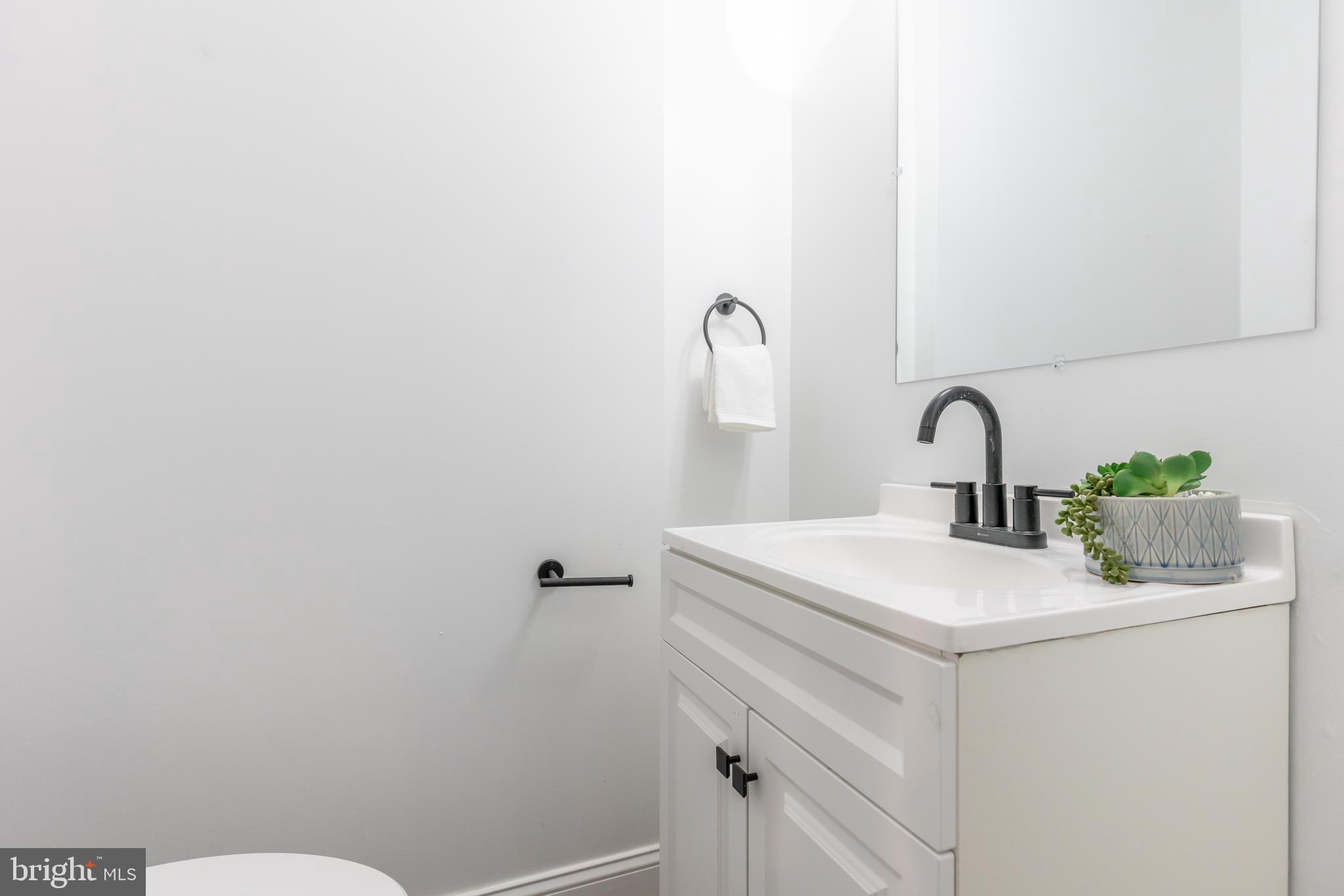 3651 Cottage Avenue Baltimore, MD 21215 - Photo 6 of 38 a bathroom with a sink and a toilet