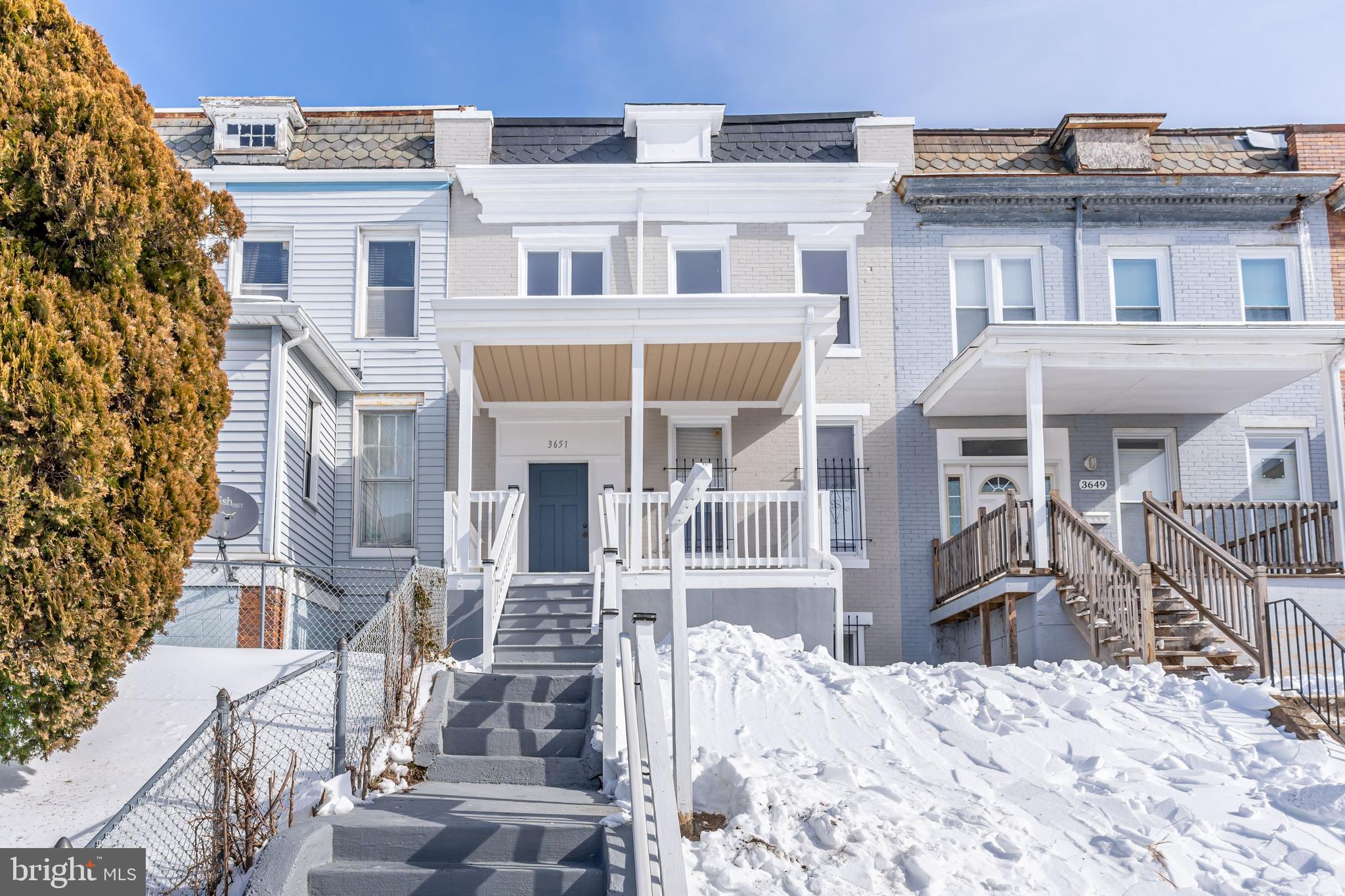 3651 Cottage Avenue Baltimore, MD 21215 - Photo 9 of 38 a front view of a house with a yard