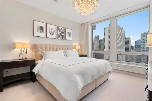 a view of walk in closet with clothes