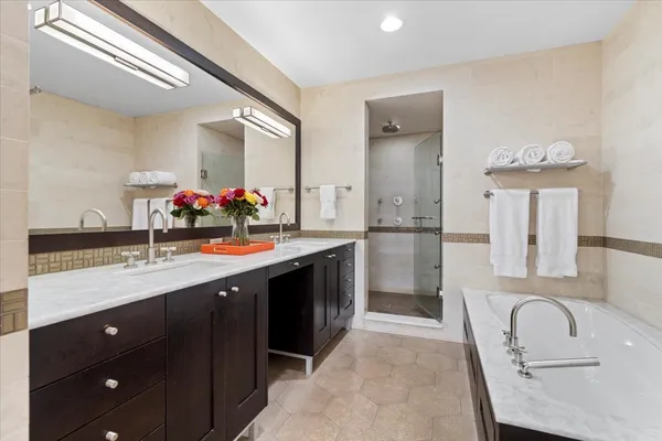 a living room with fireplace furniture and a large window