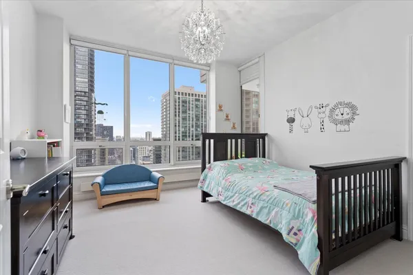 a view of a hallway with wooden shelves