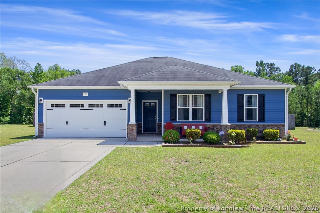 216 Meherrin Loop Raeford, NC 28376 - Photo 1 of 38 a front view of house with yard