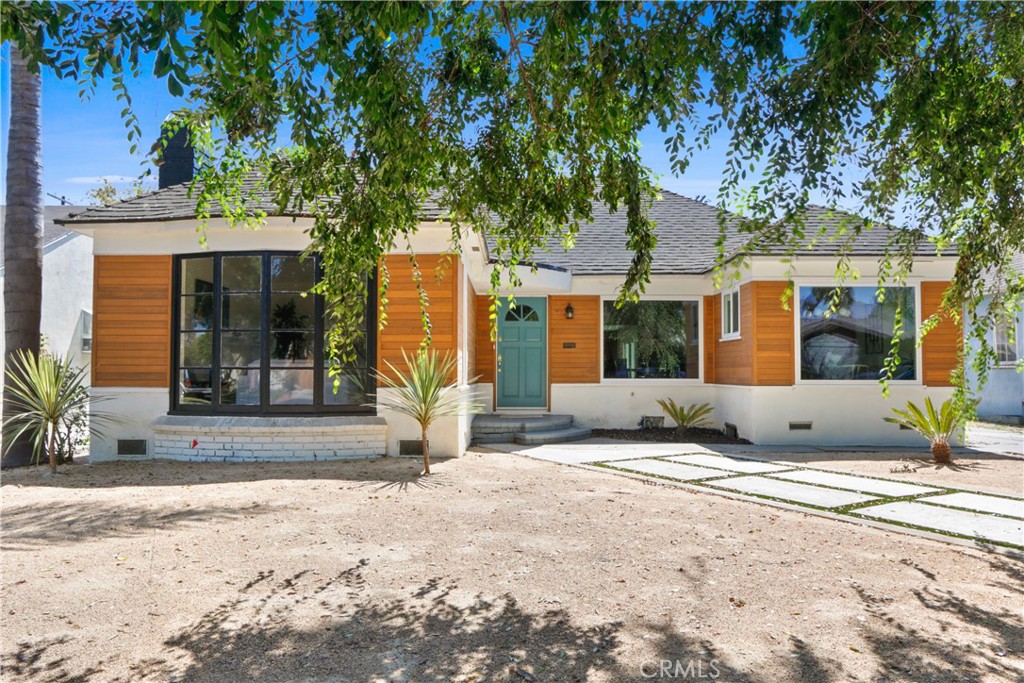 3800 Virginia Road Los Angeles, CA 90008 - Photo 1 of 1 a view of a house with a tree and a yard