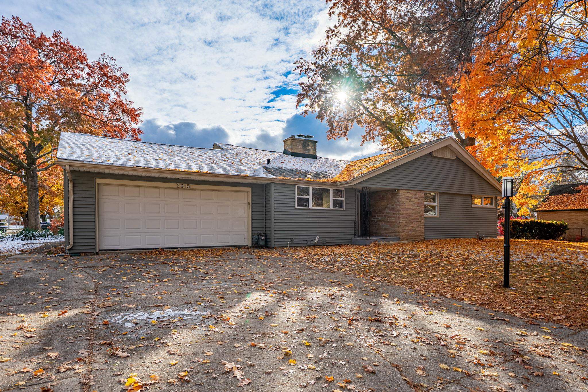 2915 Rural Street Rockford, IL 61107 - Photo 1 of 42 a front view of house with yard and trees