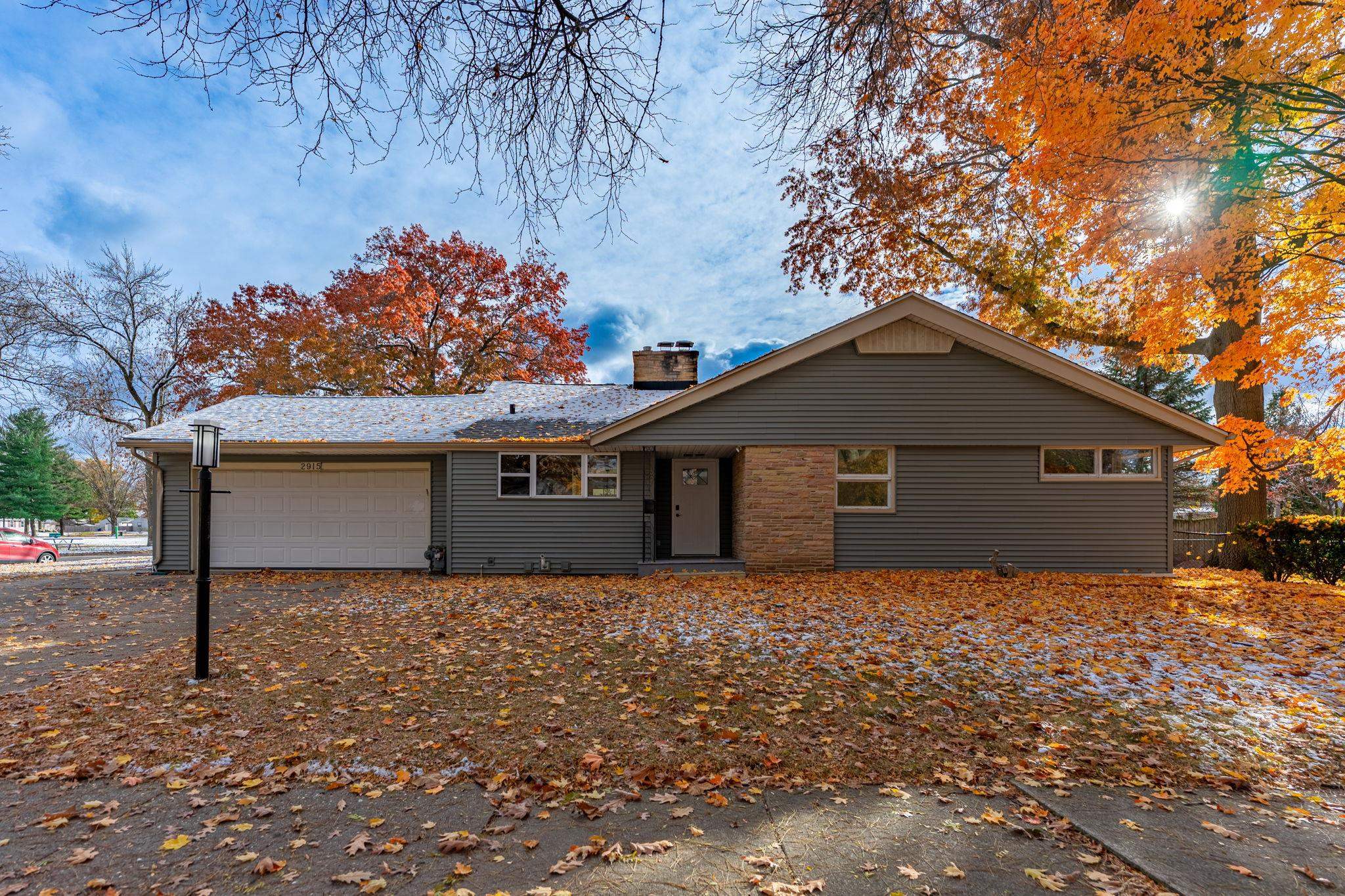 2915 Rural Street Rockford, IL 61107 - Photo 2 of 42 a house with trees in the background