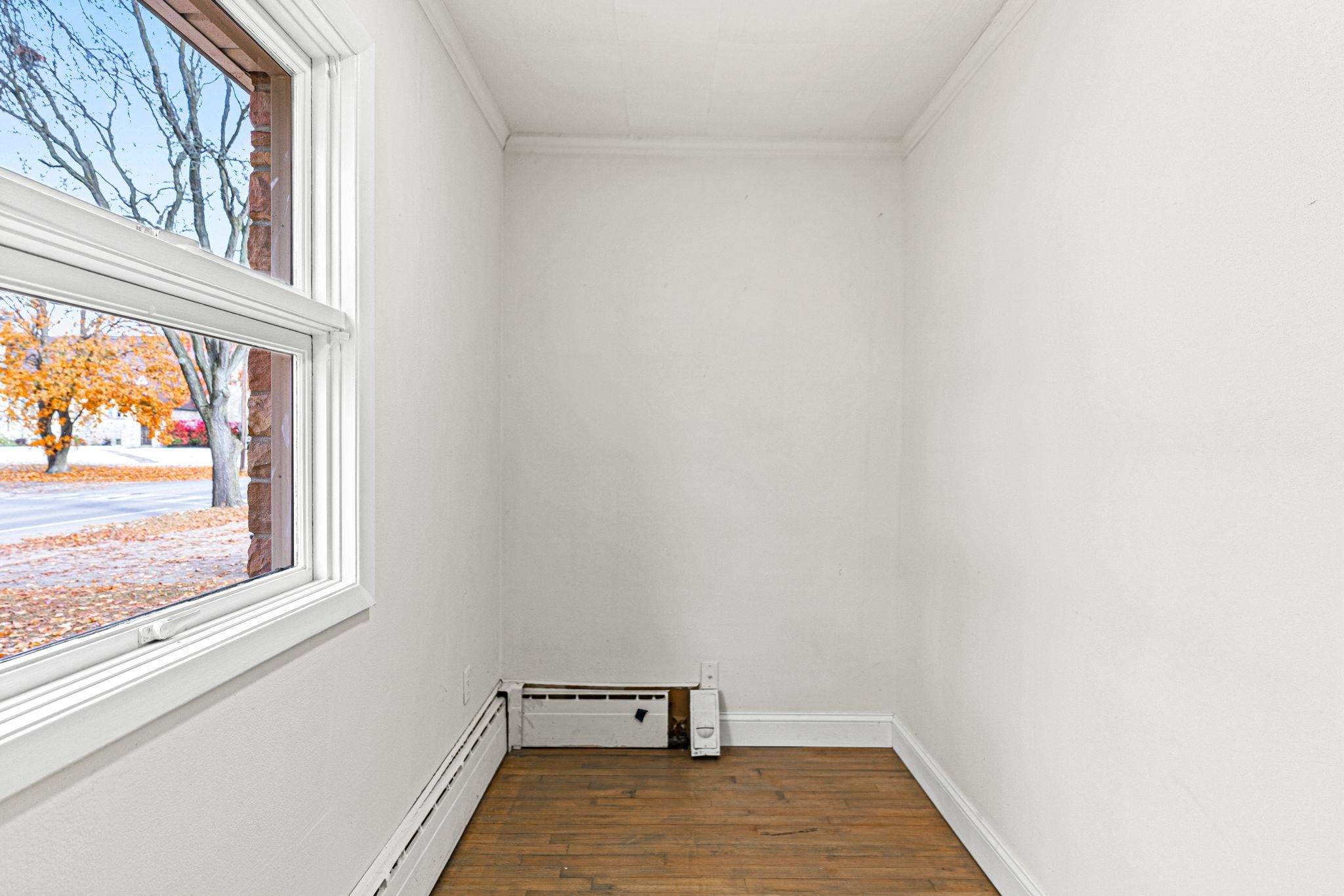 2915 Rural Street Rockford, IL 61107 - Photo 22 of 42 a view of a hallway with wooden floor and a window