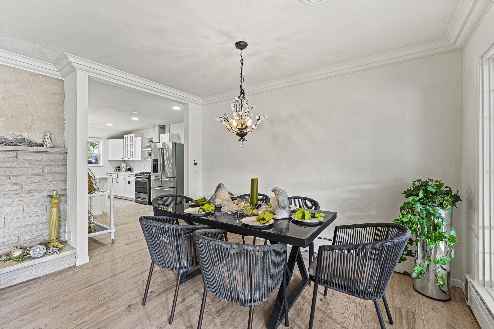 2915 Rural Street Rockford, IL 61107 - Photo 9 of 42 a dining room filled chandelier and wooden floor