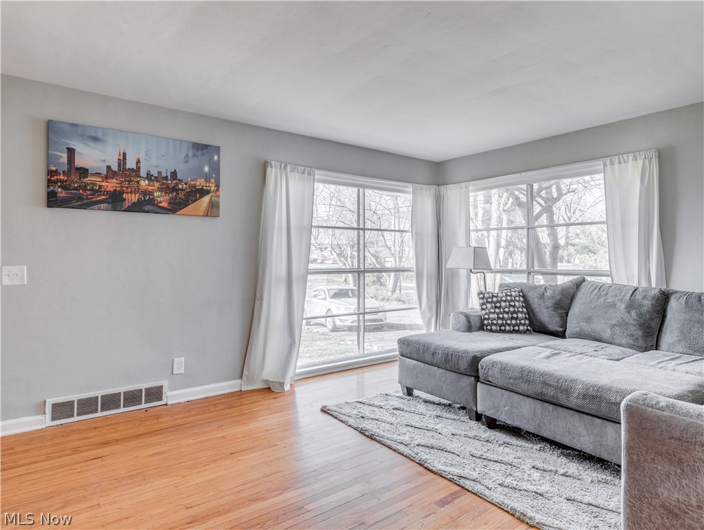 Hardwood floors. lots of natural lighting and freshly painted walls make this room light and airy.