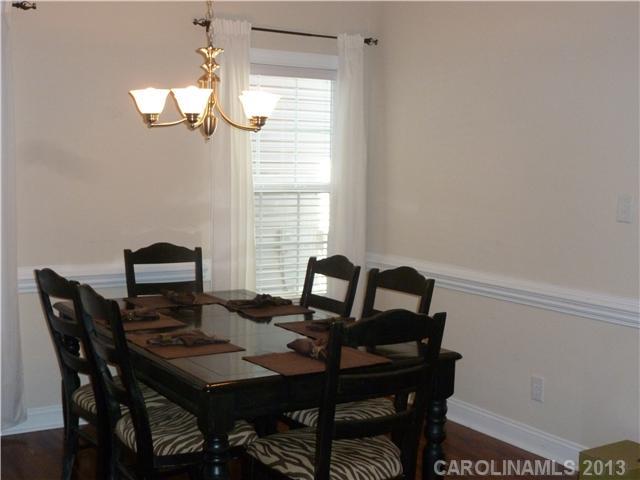 78059 Rillstone Drive Lancaster, SC 29720 - Photo 2 of 16 a view of a dining room with furniture and chandelier