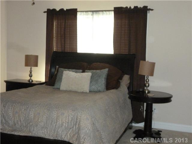78059 Rillstone Drive Lancaster, SC 29720 - Photo 7 of 16 a bedroom with a bed and a table