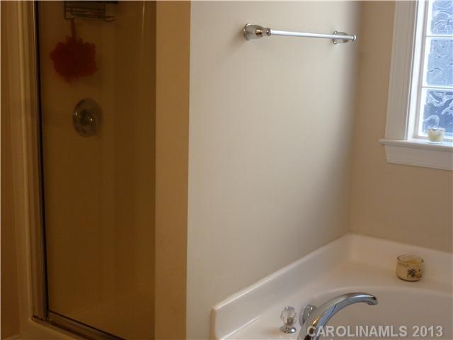78059 Rillstone Drive Lancaster, SC 29720 - Photo 8 of 16 a bathroom with a bathtub and a shower