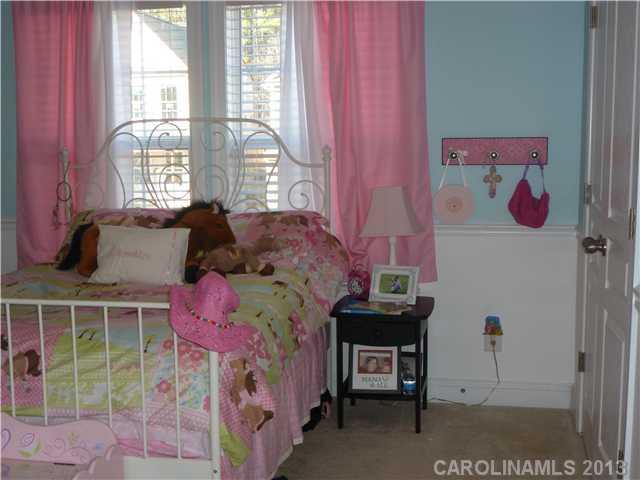 78059 Rillstone Drive Lancaster, SC 29720 - Photo 10 of 16 a bedroom with a bed and a window