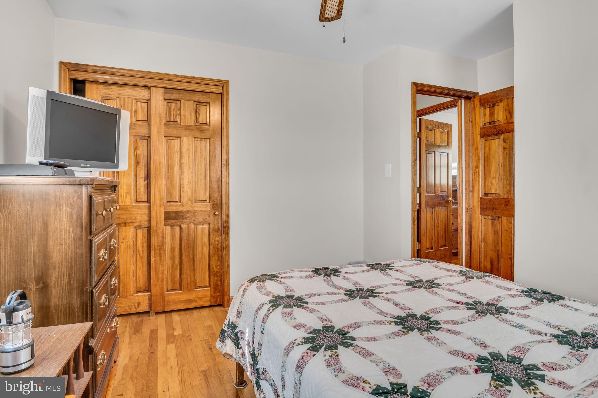 1325 Goodyear Road Gardners, PA 17324 - Photo 20 of 39 a bedroom with a bed and a flat screen tv