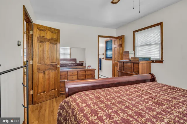 a kitchen with a refrigerator and a stove top oven