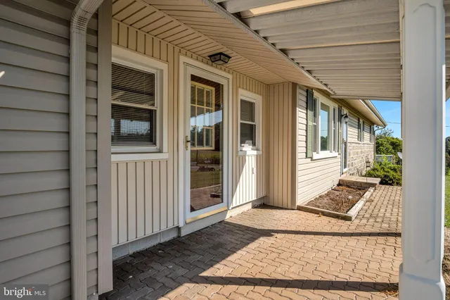 a view of a house with a door and wooden floor