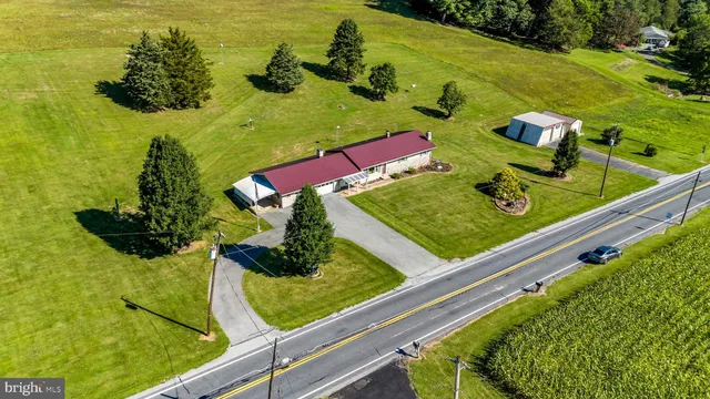 a view of a swimming pool with chairs