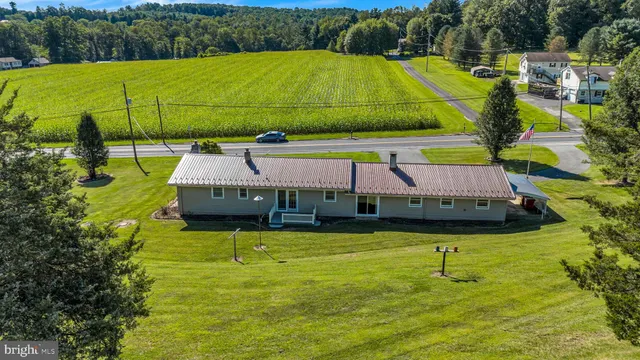 a aerial view of a house with a swimming pool