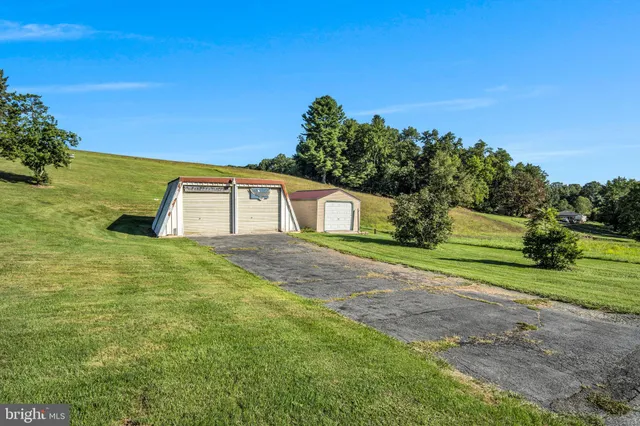 a house view with a big yard