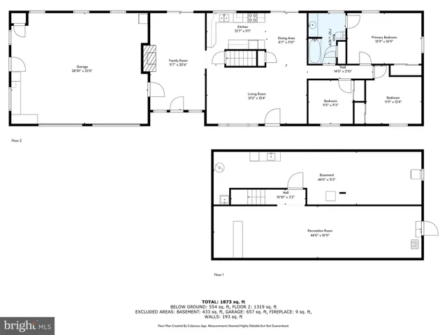 a picture of a white wall and black white refrigerator