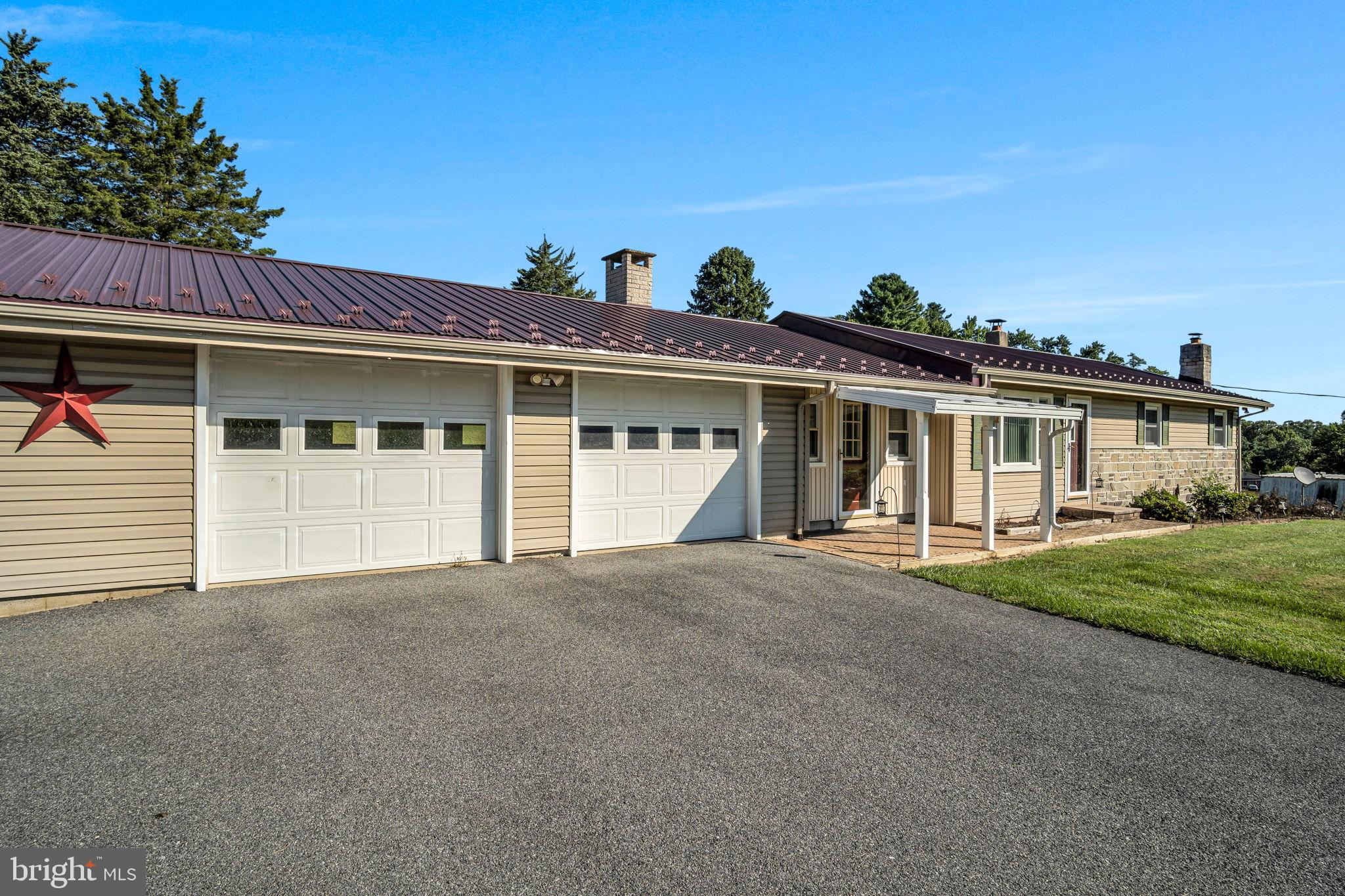 1325 Goodyear Road Gardners, PA 17324 - Photo 6 of 39 a front view of a house with a garden and yard