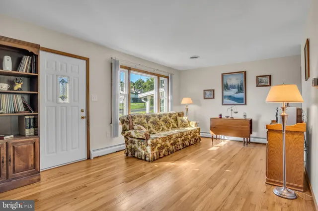 a living room with furniture and a lamp