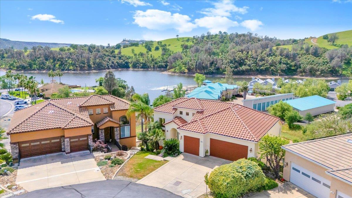 33 Aurora Lane Copperopolis, CA 95228 - Photo 1 of 46 drone / aerial view of Lake Tulloch and a tree filled landscape