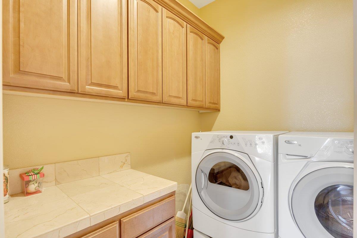 33 Aurora Lane Copperopolis, CA 95228 - Photo 26 of 46 laundry area with cabinet space and independent washer and dryer