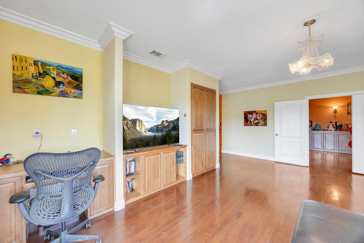 33 Aurora Lane Copperopolis, CA 95228 - Photo 31 of 46 office area with hanging lights, light wood-type flooring, and crown molding
