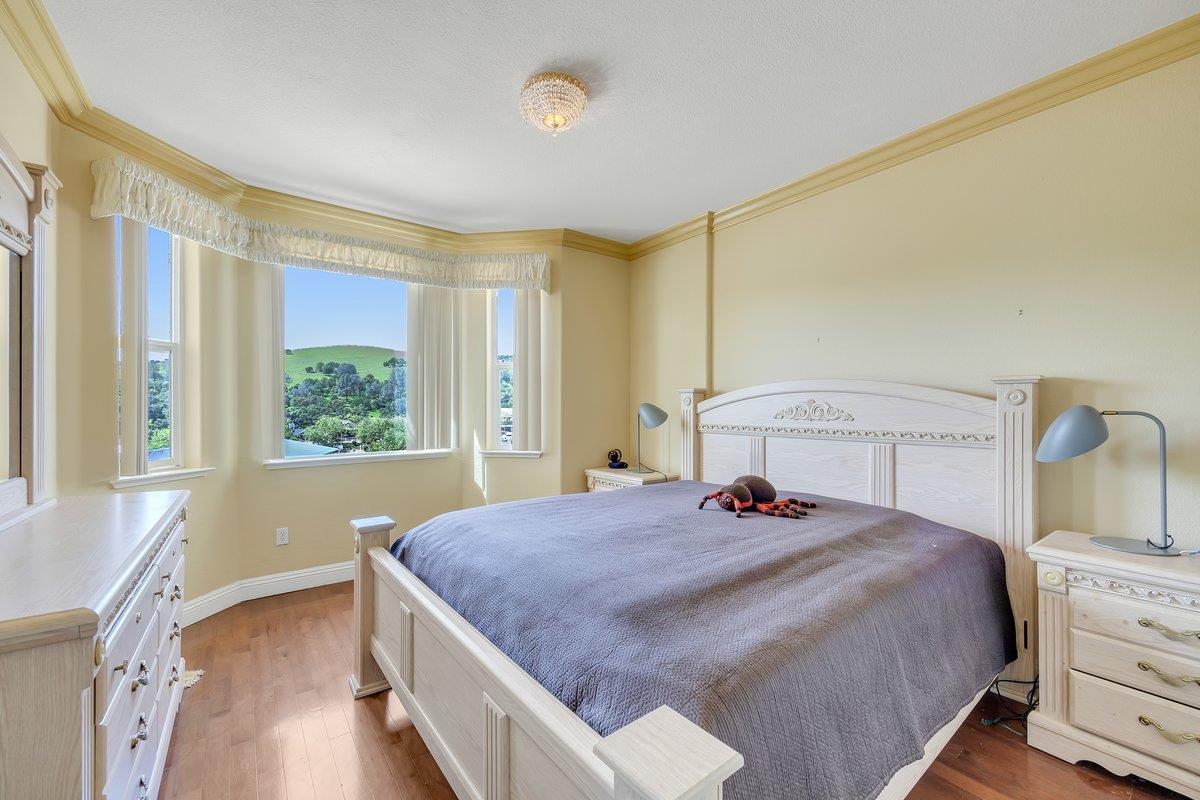 33 Aurora Lane Copperopolis, CA 95228 - Photo 33 of 46 bedroom with dark wood-style flooring and crown molding