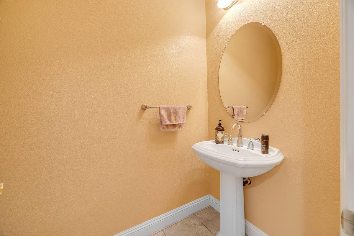 33 Aurora Lane Copperopolis, CA 95228 - Photo 34 of 46 bathroom with light tile patterned floors and pedestal sink