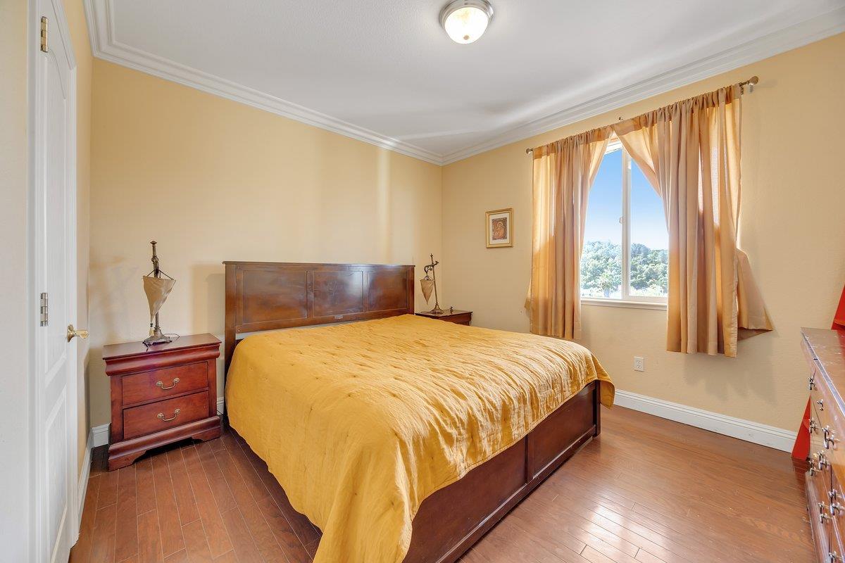 33 Aurora Lane Copperopolis, CA 95228 - Photo 35 of 46 bedroom with dark wood-style flooring and ornamental molding