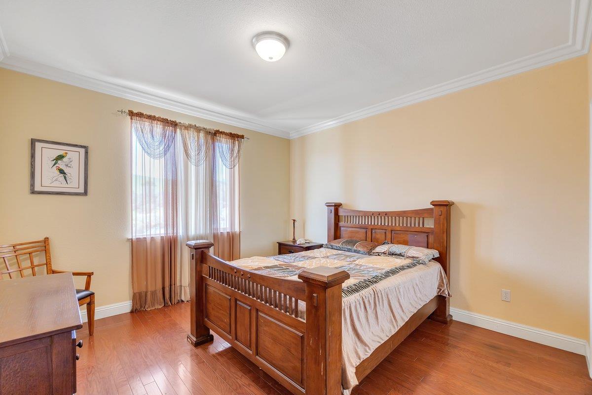 33 Aurora Lane Copperopolis, CA 95228 - Photo 37 of 46 bedroom with wood-type flooring and crown molding