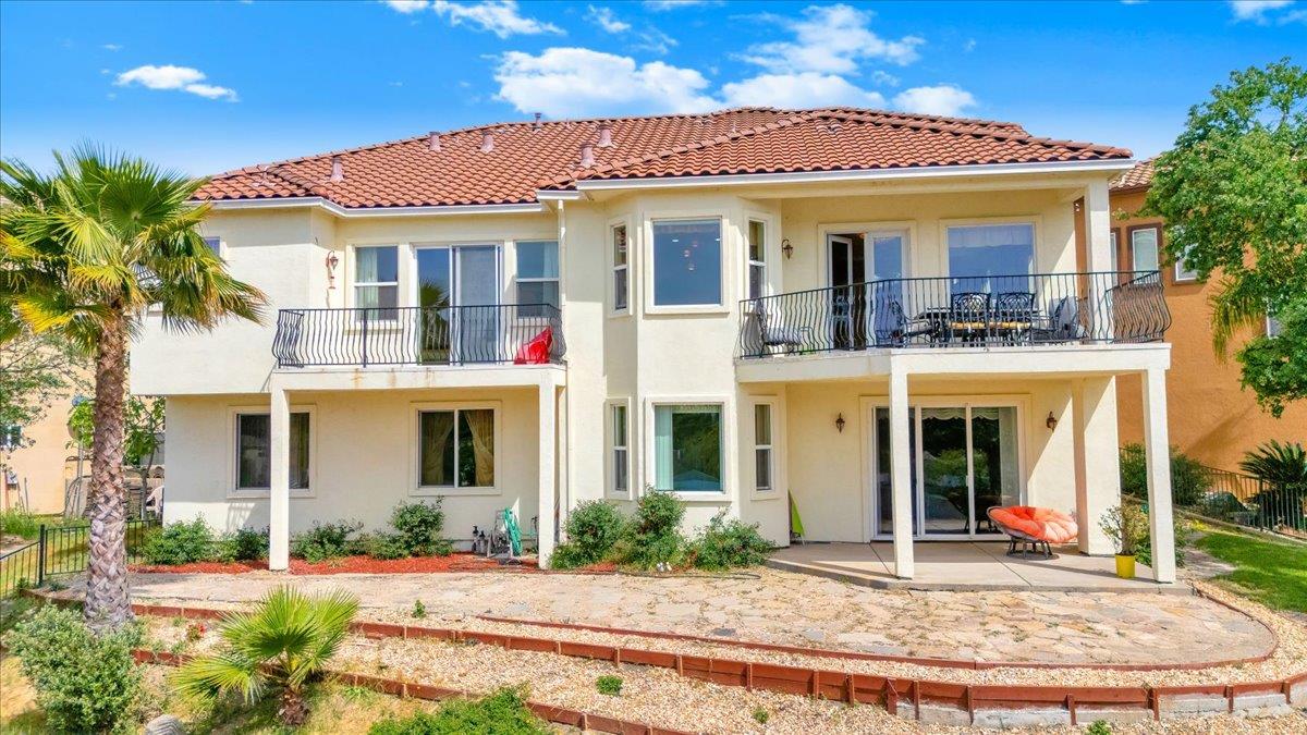33 Aurora Lane Copperopolis, CA 95228 - Photo 44 of 46 rear view of property with stucco siding, a patio, a balcony, and a tiled roof