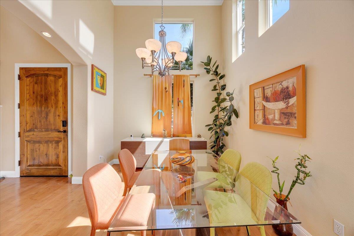 33 Aurora Lane Copperopolis, CA 95228 - Photo 5 of 46 dining space featuring hanging lights, wood finished floors, and a high ceiling