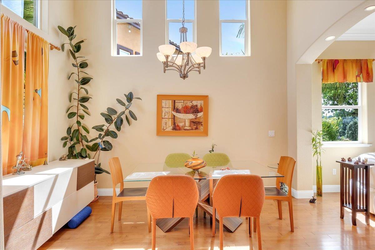33 Aurora Lane Copperopolis, CA 95228 - Photo 7 of 46 dining area featuring wood finished floors, a chandelier, and arched walkways