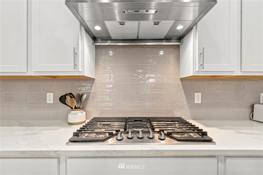 1416 242nd Place Southeast Bothell, WA 98021 - Photo 15 of 39 a stove top oven sitting inside of a kitchen