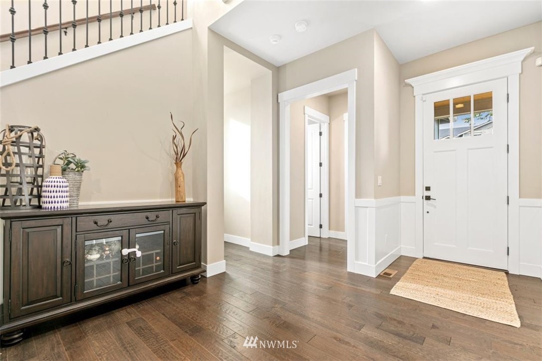 1416 242nd Place Southeast Bothell, WA 98021 - Photo 3 of 39 a view of an entryway with wooden floor