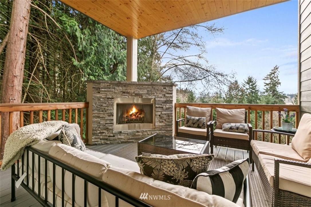 1416 242nd Place Southeast Bothell, WA 98021 - Photo 22 of 39 a view of a balcony with two chairs and a table