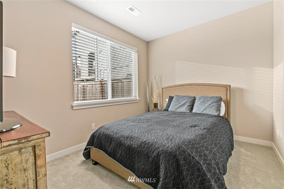 1416 242nd Place Southeast Bothell, WA 98021 - Photo 25 of 39 a bedroom with a bed and window