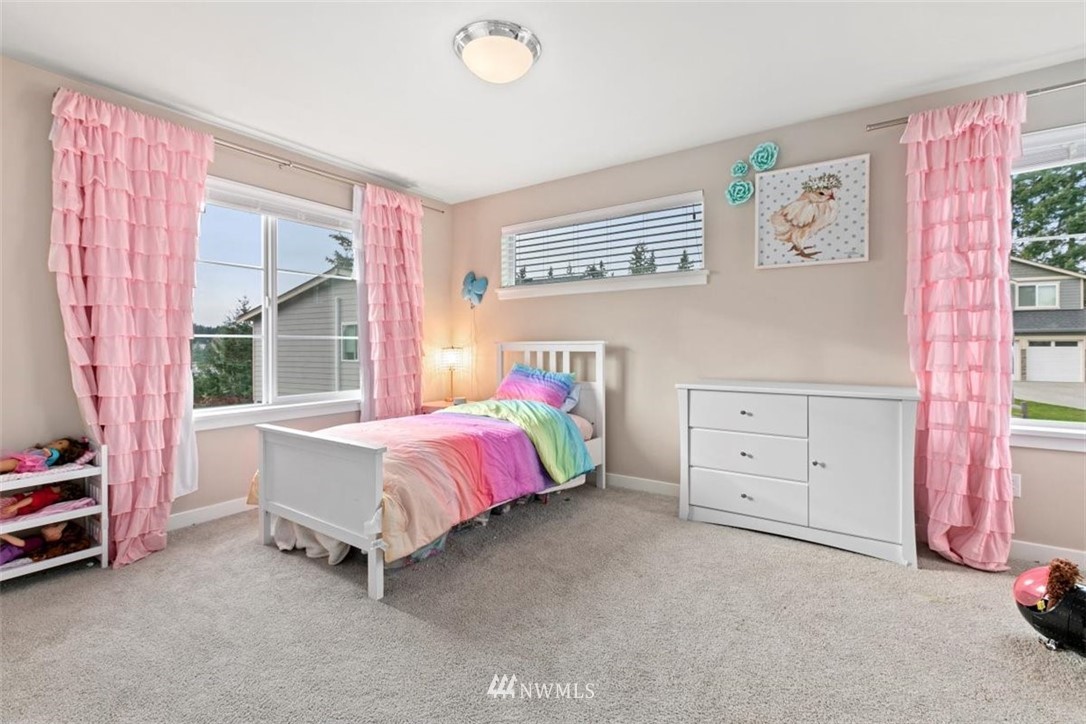1416 242nd Place Southeast Bothell, WA 98021 - Photo 26 of 39 a bed room with a bed and a window