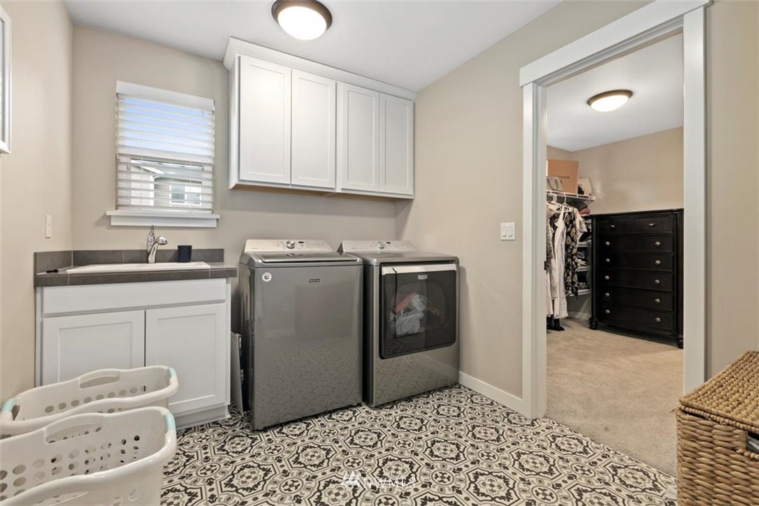 1416 242nd Place Southeast Bothell, WA 98021 - Photo 31 of 39 a bathroom with a sink toilet and shower