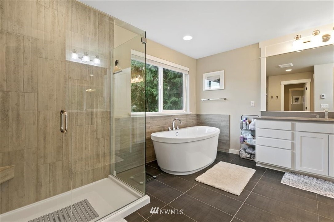 1416 242nd Place Southeast Bothell, WA 98021 - Photo 33 of 39 a bath room with a toilet a bath tub and a shower