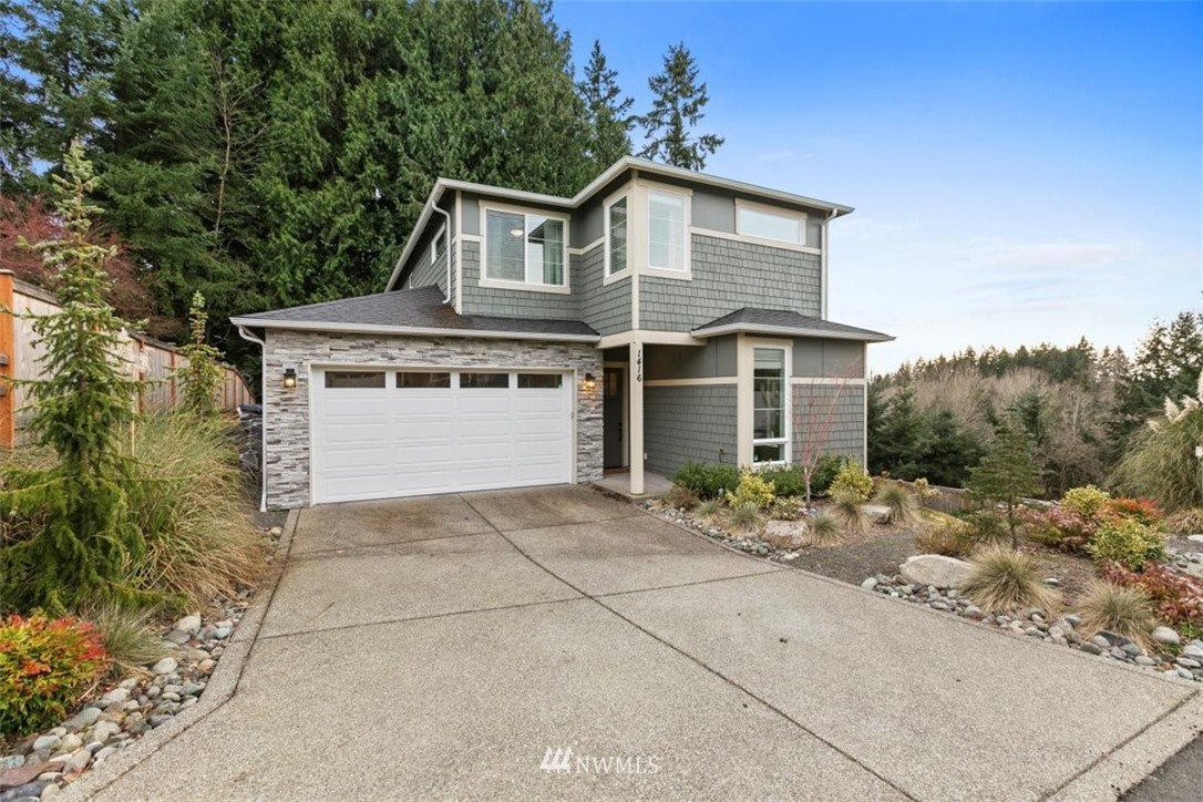1416 242nd Place Southeast Bothell, WA 98021 - Photo 37 of 39 front view of a house with a garden