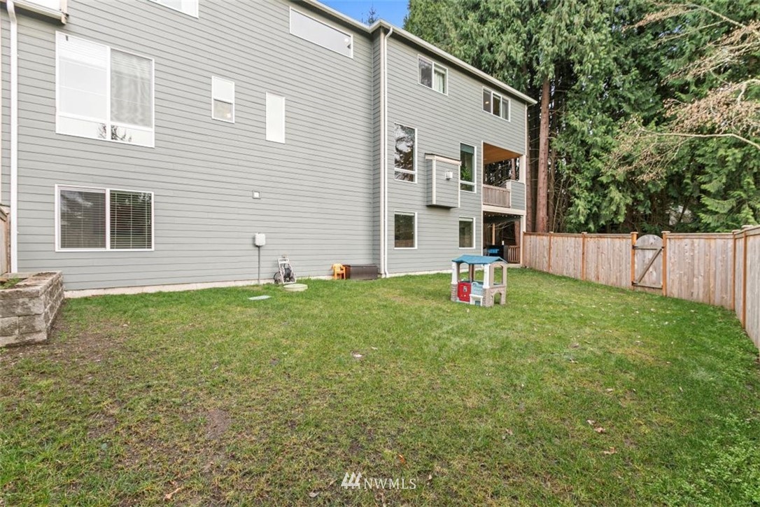 1416 242nd Place Southeast Bothell, WA 98021 - Photo 38 of 39 a house view with a garden space