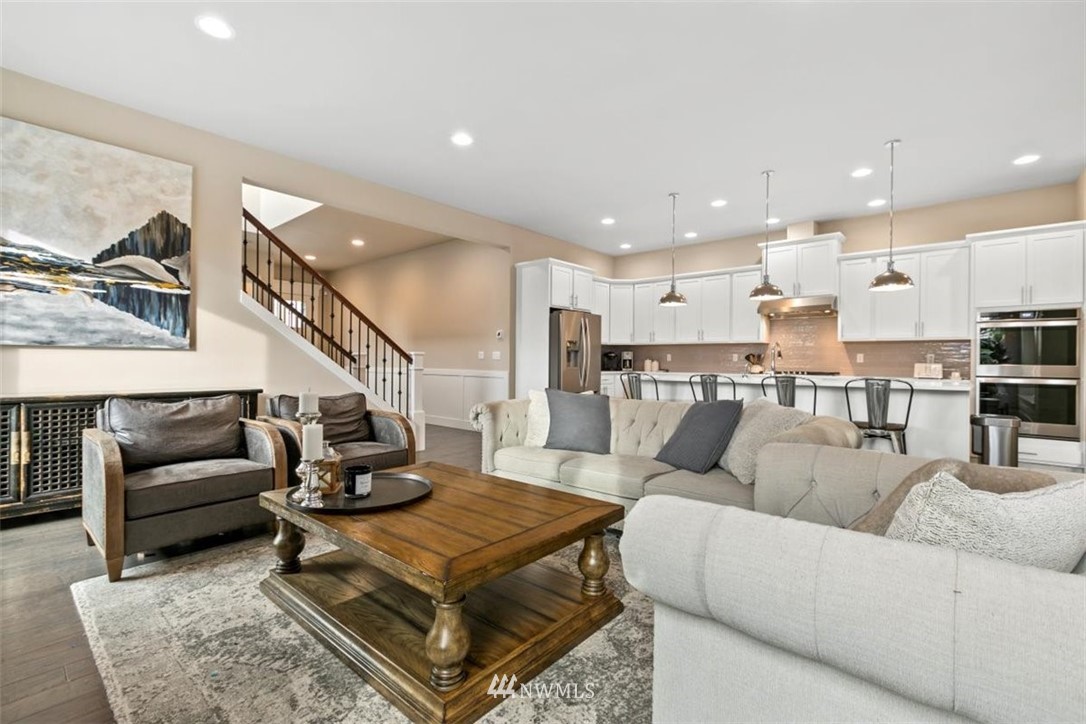 1416 242nd Place Southeast Bothell, WA 98021 - Photo 7 of 39 a living room with furniture kitchen view and a table