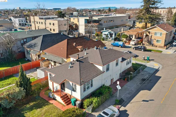an aerial view of a houses with a city view