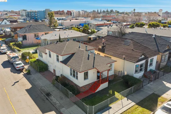 an aerial view of a house with a yard